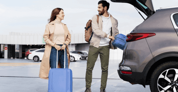Couple loading luggage into SUV – car rental services for every travel need in Perth
